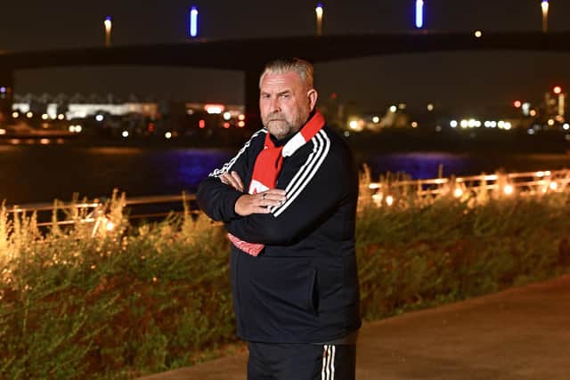 Perry McMillian by Itchen Bridge, Southampton, where the bridge is lit by blue lighting
