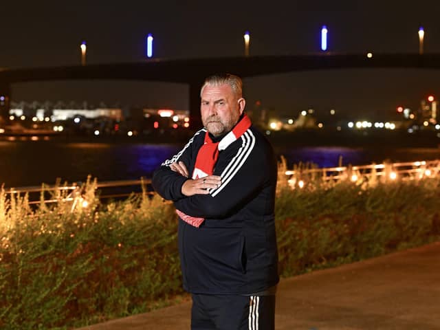 Perry McMillian by Itchen Bridge, Southampton, where the bridge is lit by blue lighting