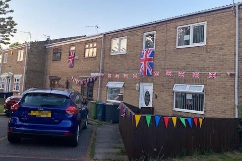 The bunting is out before the party starts for VE Day.