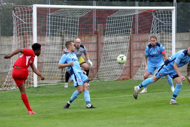 Horndean's Fuzz Kanjanda, left, has an attempt on the AFC Portchester goal. Picture: Sam Stephenson