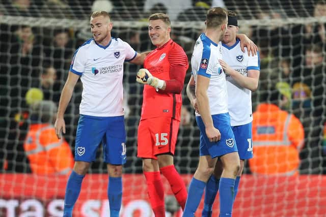 Jubilant Jack Whatmough, Craig MacGillivray and their Pompey team-mates celebrate inflicting an FA Cup shock on Norwich in Carrow Road in January 2019. Picture: Joe Pepler