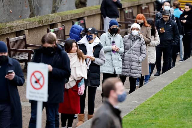 Members of the public queue to receive a dose of a Covid-19 vaccine. Picture: TOLGA AKMEN/AFP via Getty Images