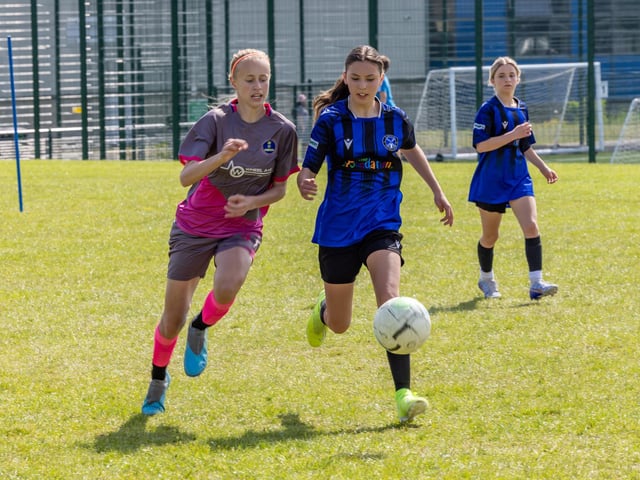 City Ladies (pink/grey kit) versus Clanfield Girls (blue) in the Clanfield youth football tournament at Horndean Technology College. Picture: Mike Cooter