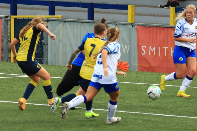 Ella Wright, left, scores. Picture by Dave Haines