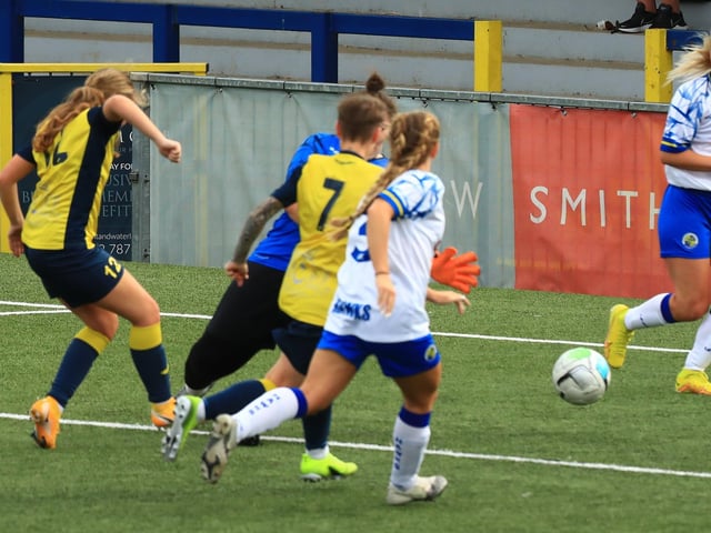 Ella Wright, left, scores. Picture by Dave Haines