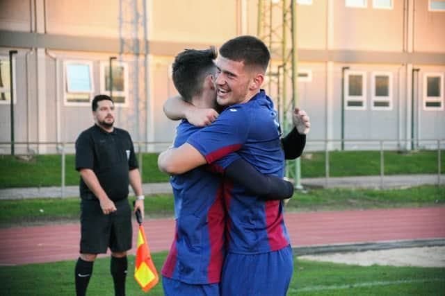 US Portsmouth midfielder Florjet Vucaj, right, celebrates a goal in the 4-1 win against Cowes. Picture: Nathan Lipsham.