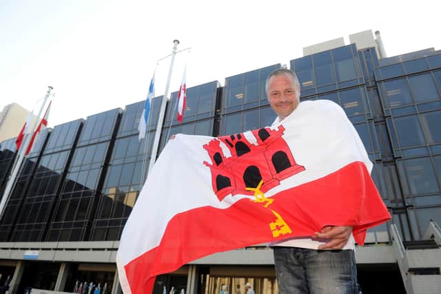Gibraltarian Stephen Sedgwick raises the Gibraltar flag outside the Civic Offices in Portsmouth for National Gibraltar Day.
Picture: Ian Hargreaves  (132448-1)