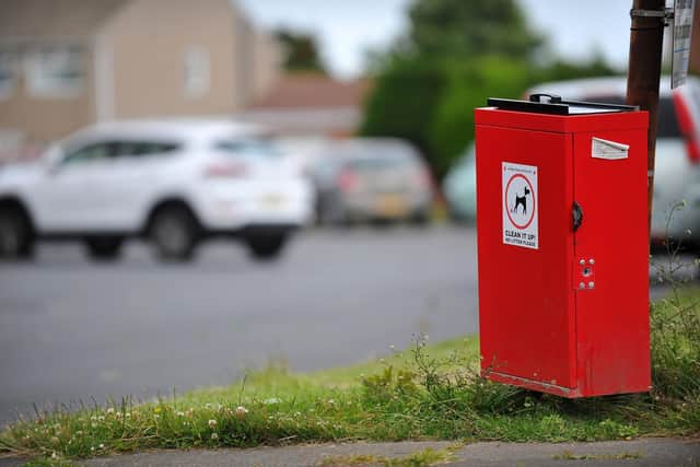 Use the dog waste bins - it's what they're there for!