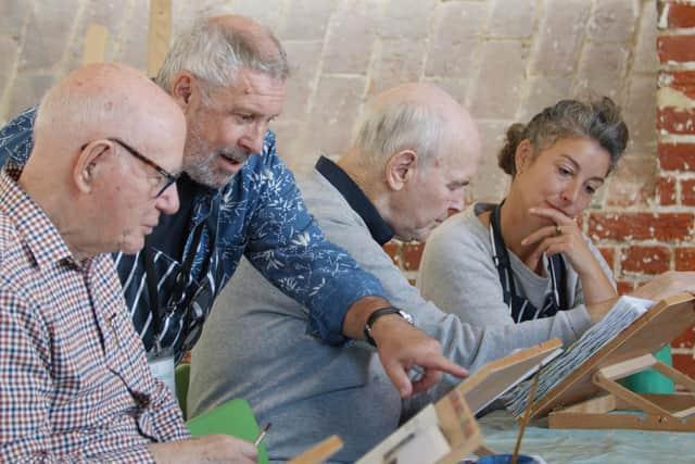 Roy Eneas (second left) and Abi Wheeler (right), are the faciltators for the Generate project run by Aspex, for people with dementia and their carers.