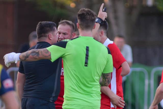 Horndean protest to referee Harry Scott prior to Moneys keeper Callum McGeorge being handed an early red card. Picture by Martyn White