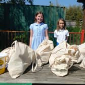Students at Birdham School's Eco Club with 40 bags of food to give away