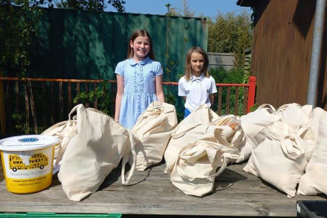Students at Birdham School's Eco Club with 40 bags of food to give away
