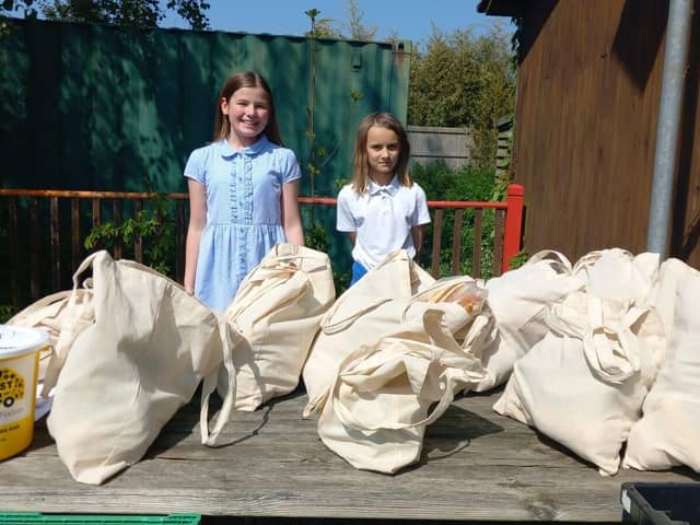 Students at Birdham School's Eco Club with 40 bags of food to give away