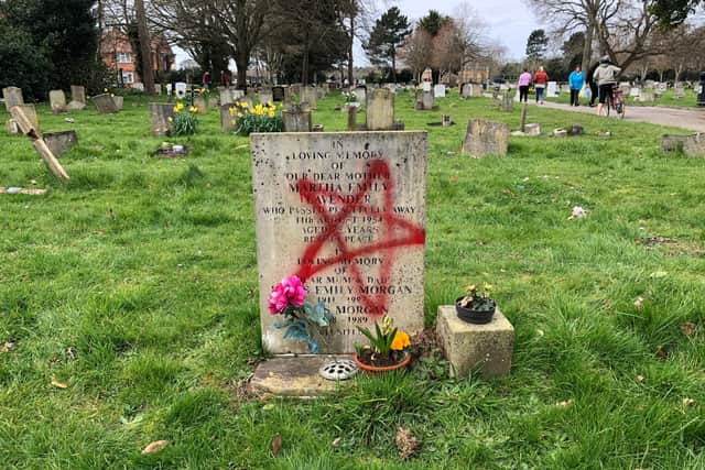 More than a dozen graves have been vandalised with spray paint in Ann's Hill Cemetery in Gosport. Picture: Richard Lemmer