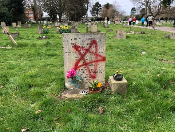 More than a dozen graves have been vandalised with spray paint in Ann's Hill Cemetery in Gosport. Picture: Richard Lemmer