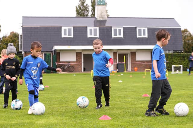 Fleur de Lys Tots training at Drayton Park with the new-look pavilion in the background. Picture: Chris Moorhouse