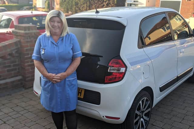 Community nurse, Helen Brunton, alongside her repaired Renault Twingo. Perkins Automotive Accident Repair Centre in Waterlooville repaired the car free of charge.