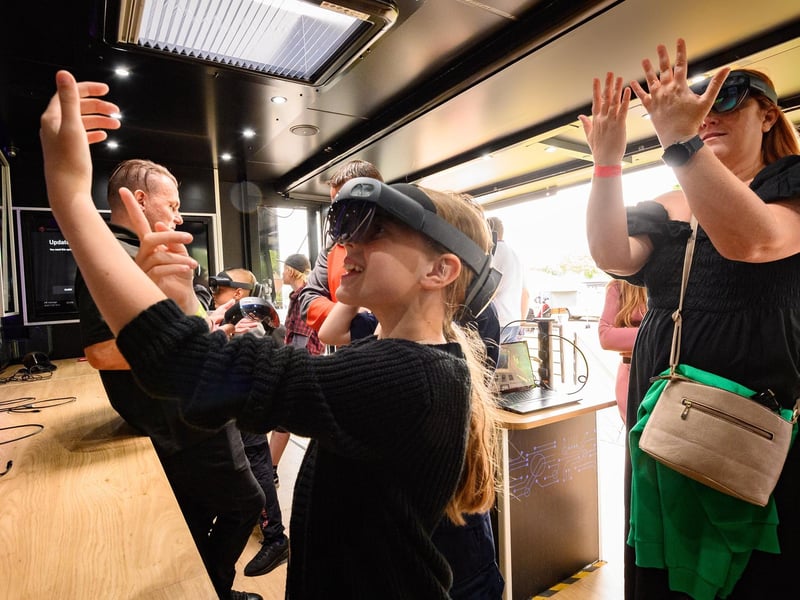 Georgia and Kelly Frank using VR Glasses on the Tech Truck at HMS Collingwood Open Day