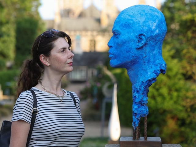 Anna Hales from Hampshire's Top Attractions admires Marc Bodie's sculpture - Between The Sea And The Sky.
