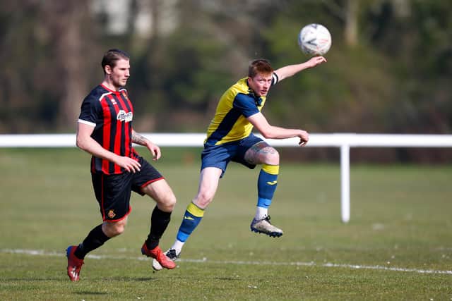 Moneyfields' Liam Kyle, right, in action at Fleetlands. Picture: Dave Bodymore