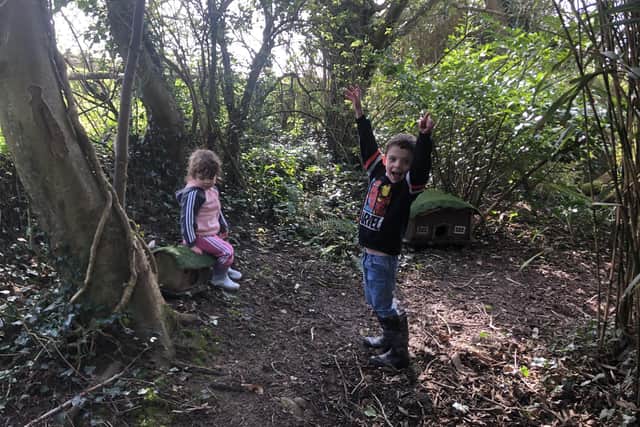 Eddie and Rosanna Morton look for pixie houses in the woods at Pickwell Manor