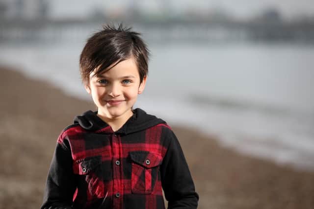 Thomas Roughan, 8, reads his poem called Ruby Red about racism which has been featured on the Black Lives Matter website. Pictured on Southsea beach.
Picture: Chris Moorhouse   (081120-22)