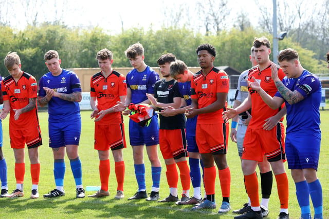 Both teams clap in memory of Mason Peddle. Picture: Chris Moorhouse