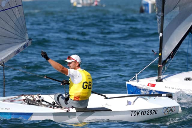 Great Britian's Giles Scott celebrates after winning the Men's One Person Dinghy (Heavyweight) Finn Medal Race at the Enoshima Yacht Harbour on the eleventh day of the Tokyo 2020 Olympic Games in Japan. Photo: Kaoru Soehata/PA Wire.