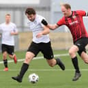 Horndean's Jon Ashford, right, with Lodge's Callum Hill. Picture: Keith Woodland