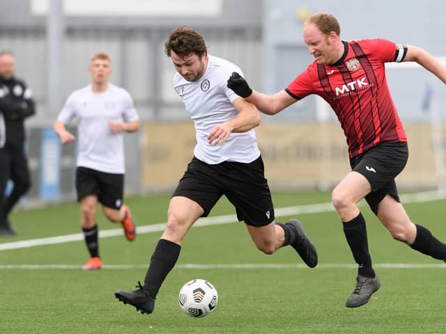 Horndean's Jon Ashford, right, with Lodge's Callum Hill. Picture: Keith Woodland