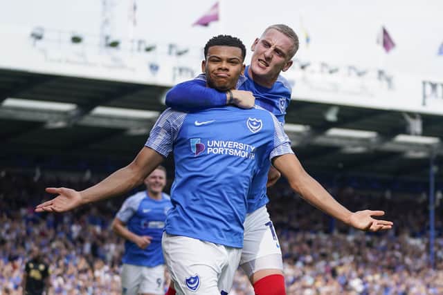 Dane Scarlett's double secures Pompey's fifth successive win.