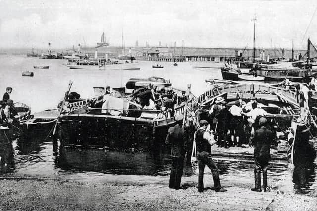 Horses and what looks like cattle about to cross the harbour from Point, Old Portsmouth, in the early years of the last century. Picture: costen.co.uk.