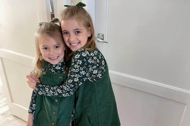 Sisters Jessica and Ella Hulks pictured celebrating after they were featured as part of the 2021 Little Troopers calendar.