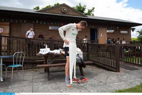 'Do these still fit?' - players from Hambledon Cricket Club change outside the clubhouse to comply with social distancing measures as they return to action at Ridge Meadow at the weekend. Picture: Jordan Pettitt/Solent News & Photo Agency