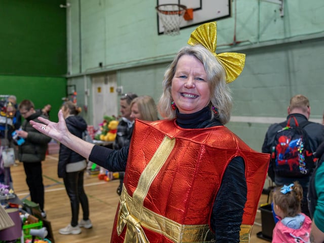 Julie Crook, manager of the Fratton Community Centre, welcomes visitors to the Christmas Fair. Picture: Mike Cooter (091223)