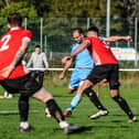 Brett Pitman scores one of his four goals for AFC Portchester in their FA Vase win at East Cowes. Picture by Daniel Haswell.