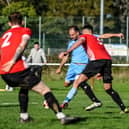 Brett Pitman scores one of his four goals for AFC Portchester in their FA Vase win at East Cowes. Picture by Daniel Haswell.