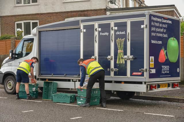 Tesco staff carrying out home deliveries during the Coronavirus lockdown, April 2020. Picture by Shutterstock