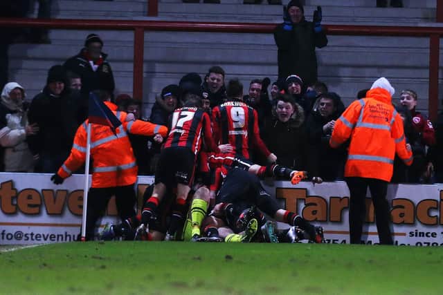 Morecambe goalkeeper Barry Roche headed home a 94th-minute corner to claim a point against Pompey. Picture: Joe Pepler