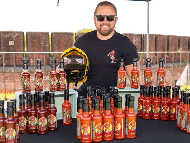 Former firefighter Matt Broxton from Kentish Town with his range of 'Saucy Firefighter' dressings. Picture: Mike Cooter (210522)