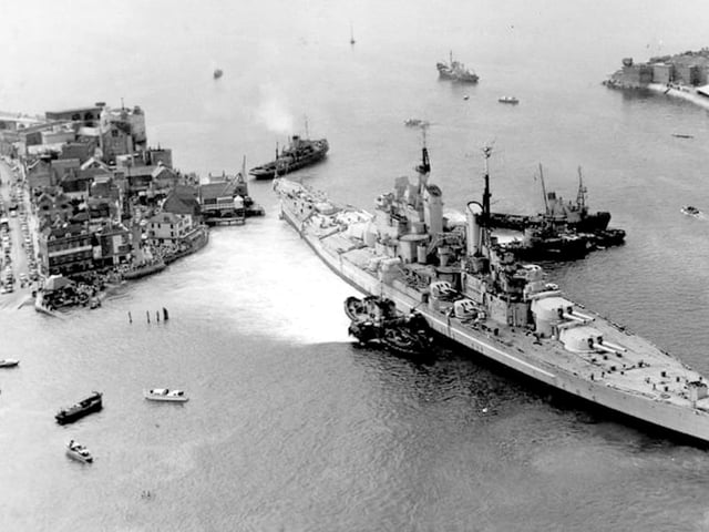 Aerial of HMS Vanguard, with a view along Broad Street to the left.