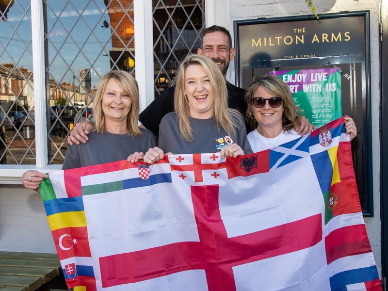 England fans gathered at the Milton Arms in Portsmouth on Sunday evening to watch England's opening game against Serbia in Euro 2024.Pictured - Tracey Ford, Landlady Christina Sloan, Landlord Dan Smith and fan Gemma WilliamPhotos by Alex Shute