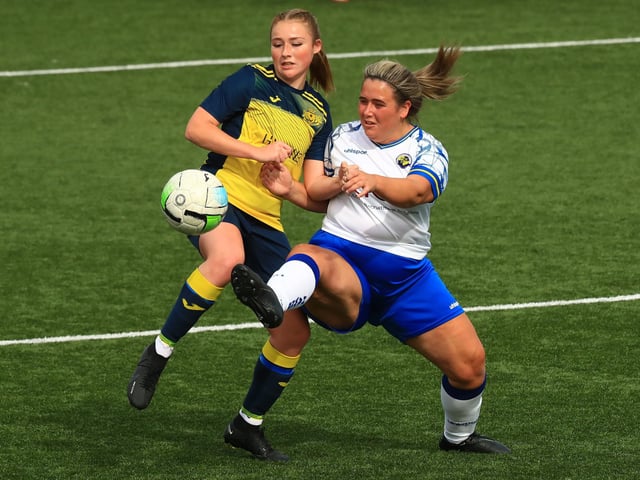Hawks' Chloe Dark challenges Maddison Watson for possession. Picture by Dave Haines