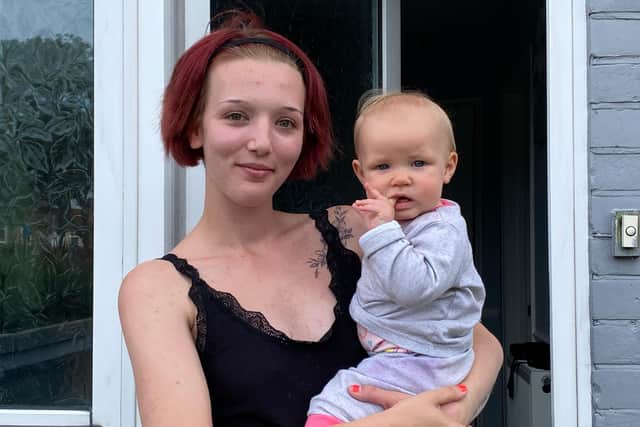 Mum Leah Lewis with her seven-month-old baby girl, Bella, outside their home in Grange Crescent, Gosport, which was affected by a flash flood on Monday morning.