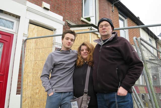 Michael McCormick with his wife Montse and their son Mark outside their destroyed home in Whale Island Way in Stamshaw, Portsmouth, on January 3 after a New Year's Day suspected gas explosion forced them to flee. Picture: Ben Fishwick