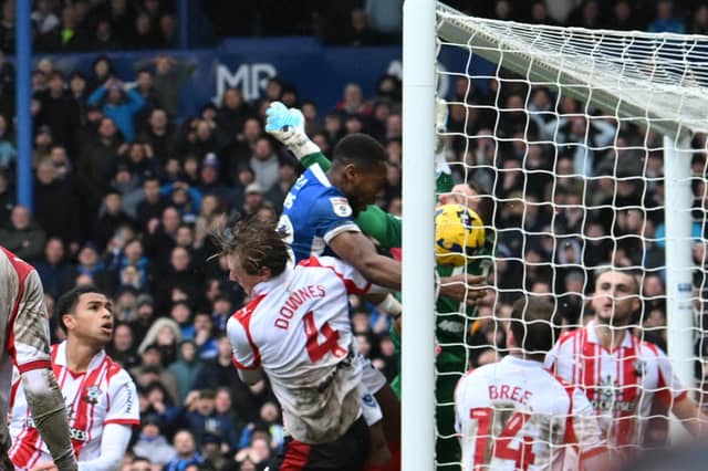 Ebou Adams heads home in the 77th minute to earn Pompey a 1-1 draw against Southampton. Picture: Graham Hunt/ProSportsImages