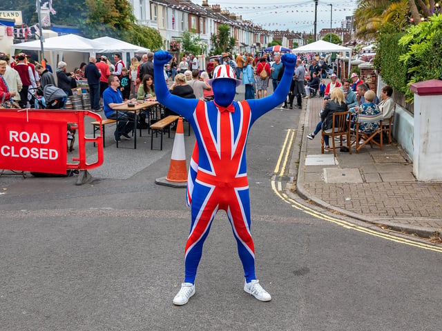 David Place welcoming guests to the hugely popular jubilee street party in Duncan Road, Southsea. Picture: Mike Cooter (050622)