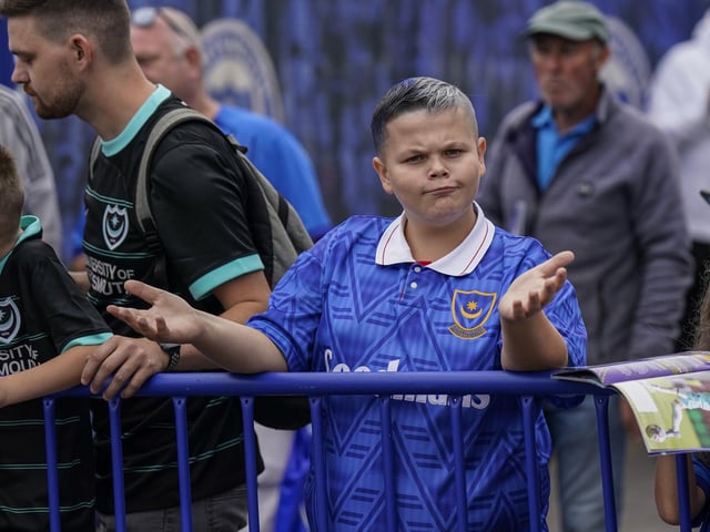 Waiting for his heroes to arrive before kick-off.