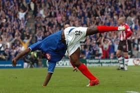 Lomana Lualua celebrates his first goal with his usual style.