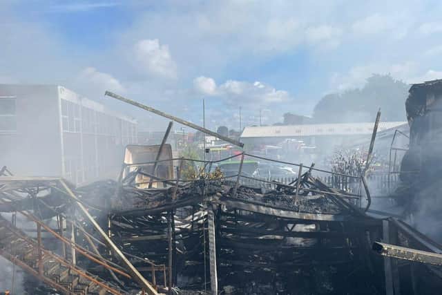 More than 80 firefighters were deployed to tackle a ferocious garage fire, which spread to nearby vehicles and buildings. Smoke could be seen filling the sky.